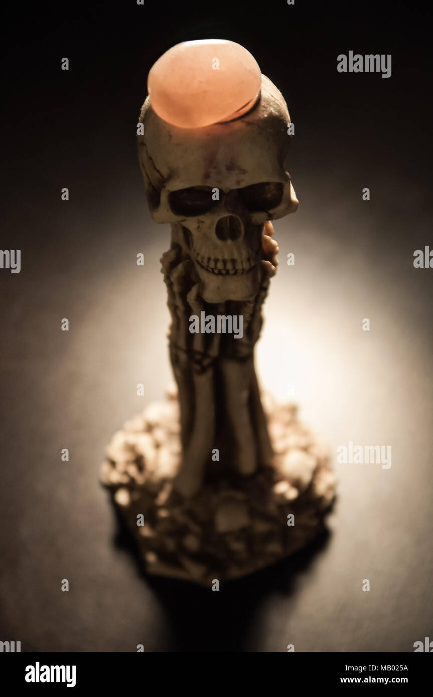 A conceptual skeleton figure in dramatic spotlight Stock Photo