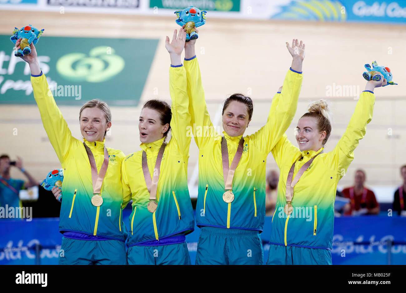 Left to right, Australia's Annette Edmondson, Amy Cure, Ashlee Ankudinoff and Alexandra Manly celebrate on the podium with their medals after winning gold in the Women's 4000m Team Pursuit Finals at the Anna Meares Velodrome during day one of the 2018 Commonwealth Games in the Gold Coast, Australia. Stock Photo