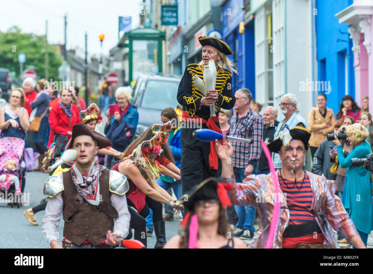 Jugglers dressed as pirates performing through the streets of Penryn Cornwall as part of the Penryn Kemeneth. Stock Photo