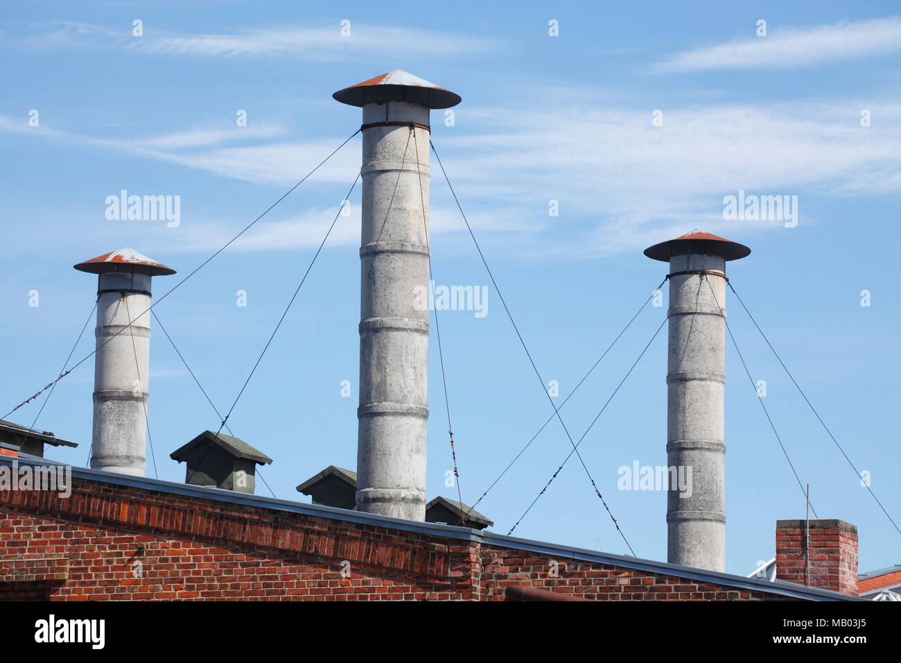 Round chimneys on a former factory building, Lueneburg, Lower Saxony, Germany, Europe   I  Runde Schornsteine auf einem ehemaligen Fabrikgebäude, Lüne Stock Photo