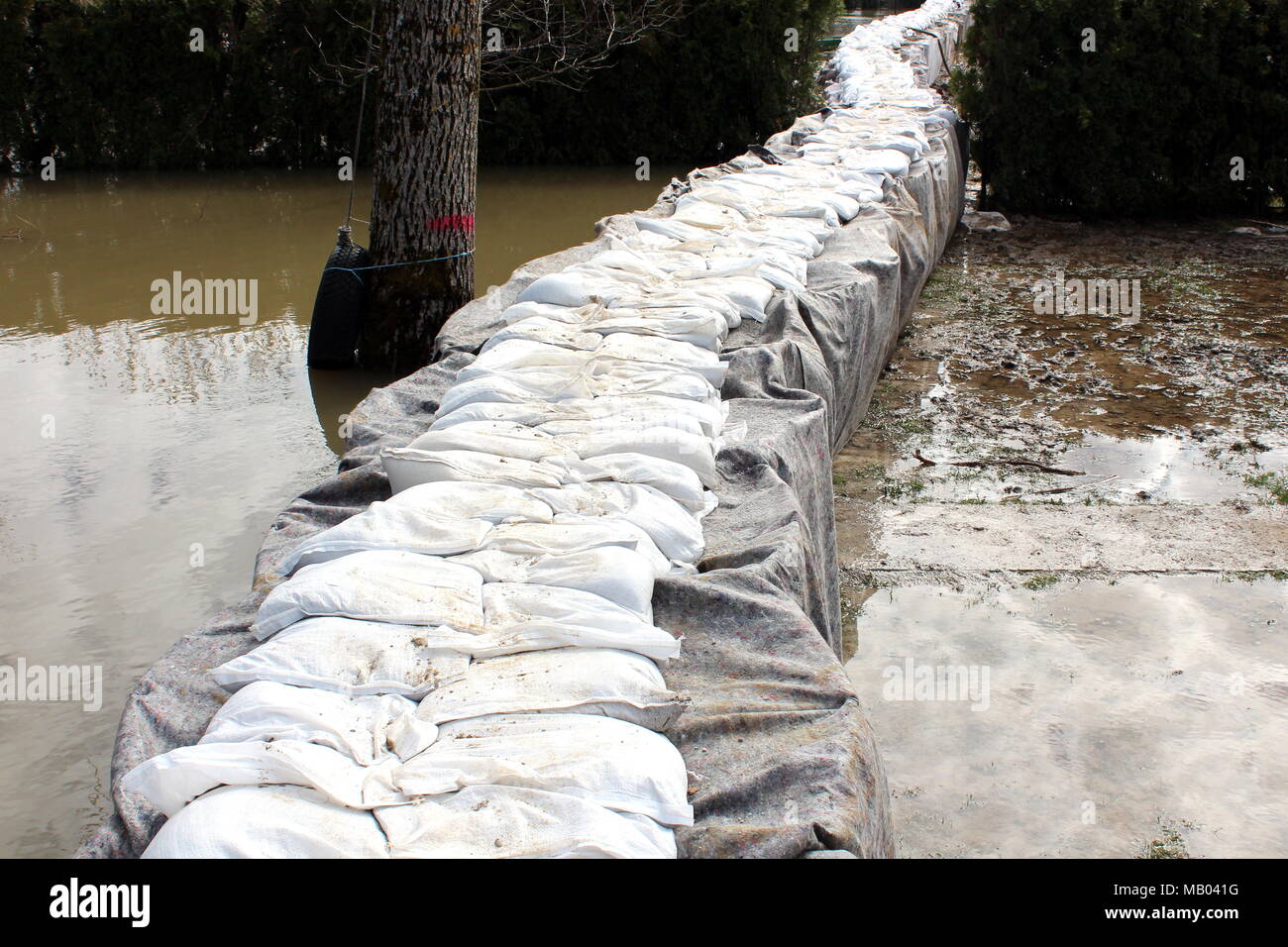 Sandbox barriers flood protection completely covered with geotextile
