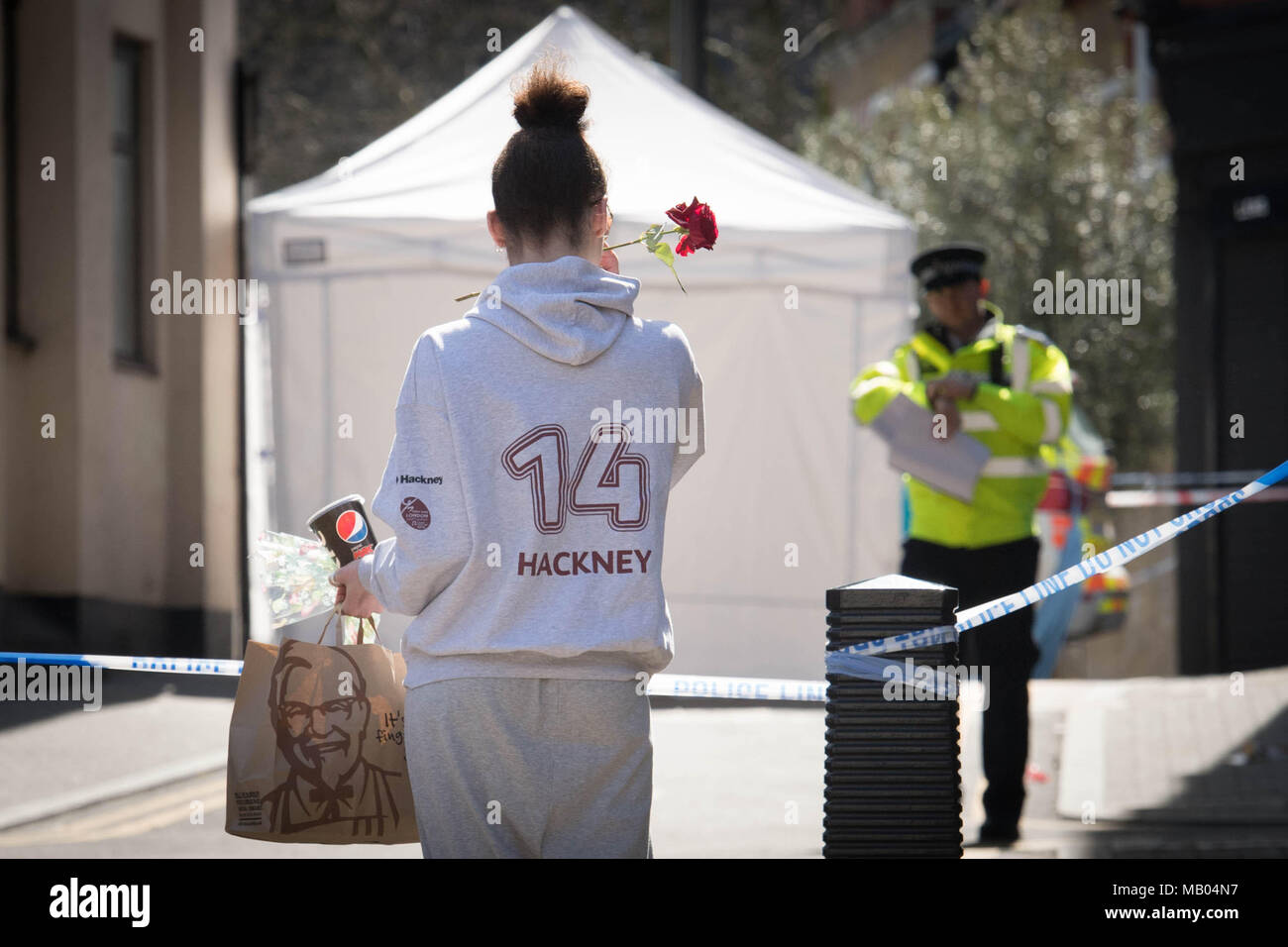 Woman brings flower to the scene in link street hires stock
