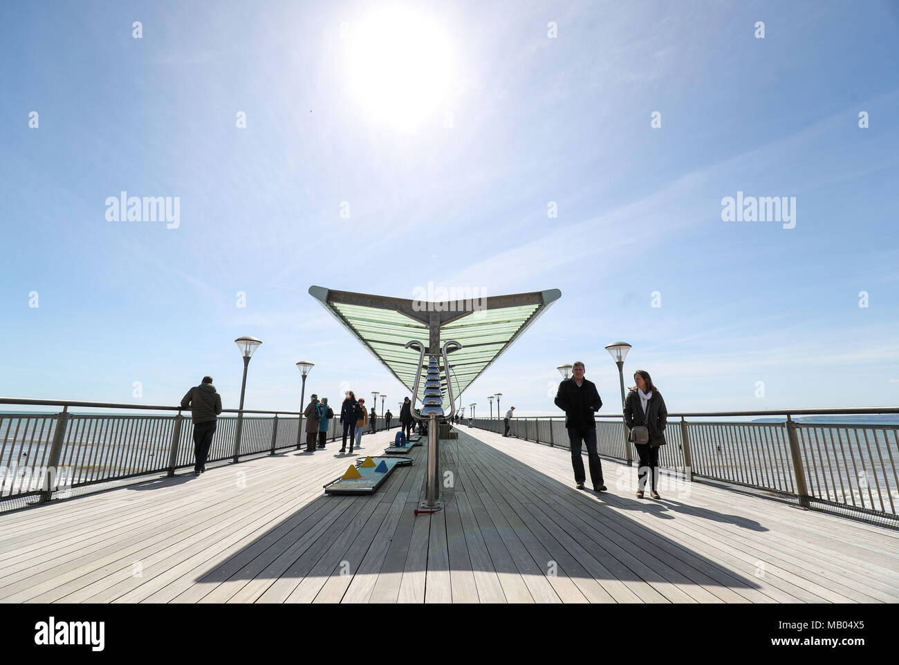 People enjoy the sunny weather on Boscombe pier in Bournemouth, Dorset. Stock Photo