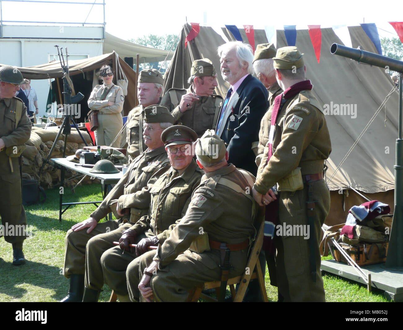 Ian Lavender best known for his role as Private Pike in the BBC comedy series Dad's Army has  fun posing  with actors at the 2009 Goodwood Revival. Stock Photo