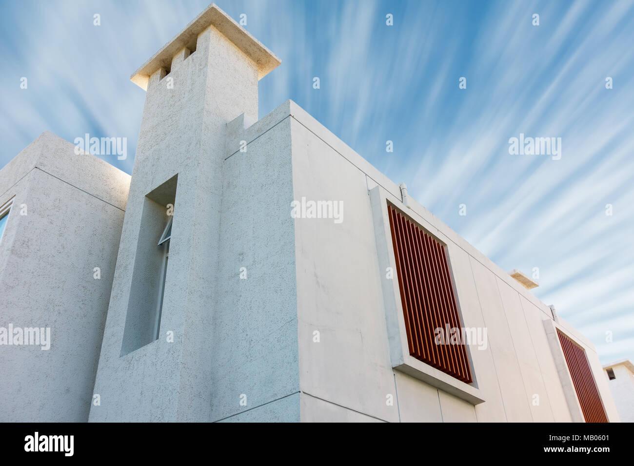 Modern house on blue skies background Stock Photo - Alamy