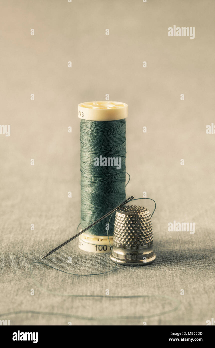 Close up of thread ,sewing needle and thimble Stock Photo