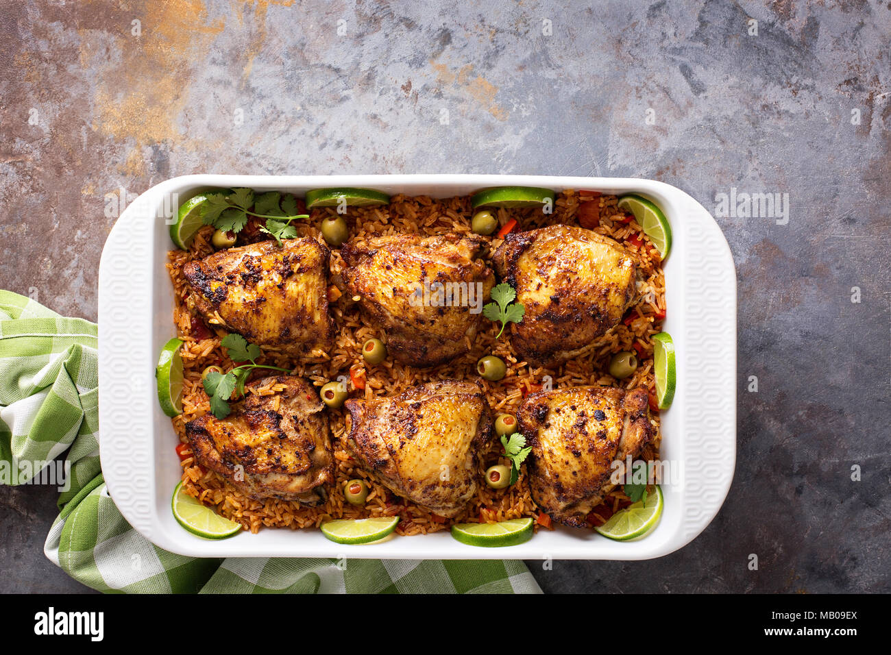 Arroz con Pollo, seared chicken with spanish rice and olives Stock Photo