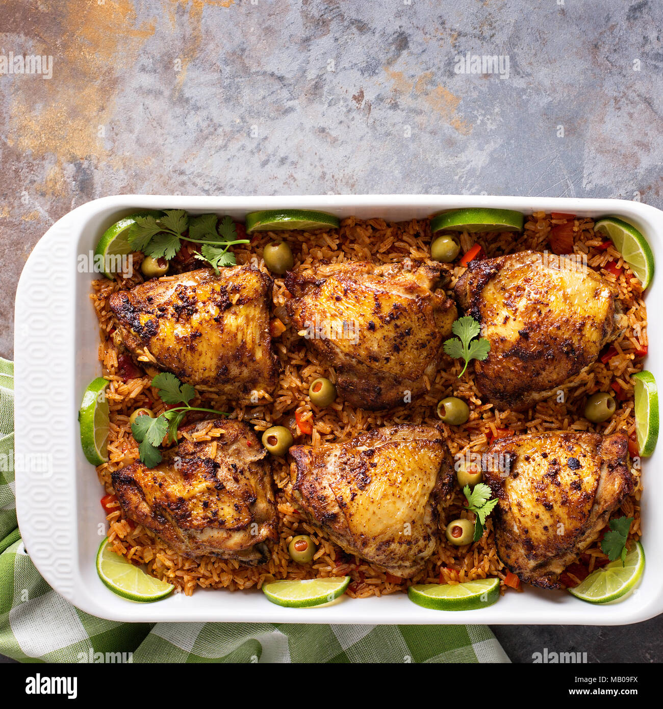 Arroz con Pollo, seared chicken with spanish rice and olives Stock Photo