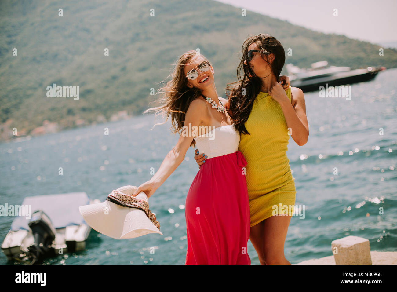 Young women on hot beach hi-res stock photography and images - Alamy