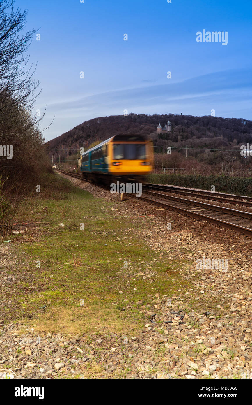 Moving train in the country side, notice the castle in the background. Stock Photo