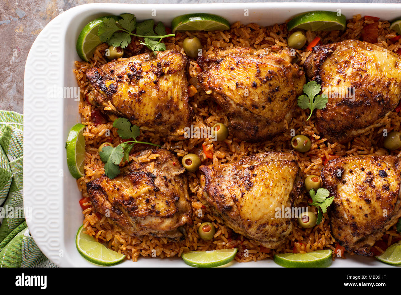 Arroz con Pollo, seared chicken with spanish rice and olives Stock Photo