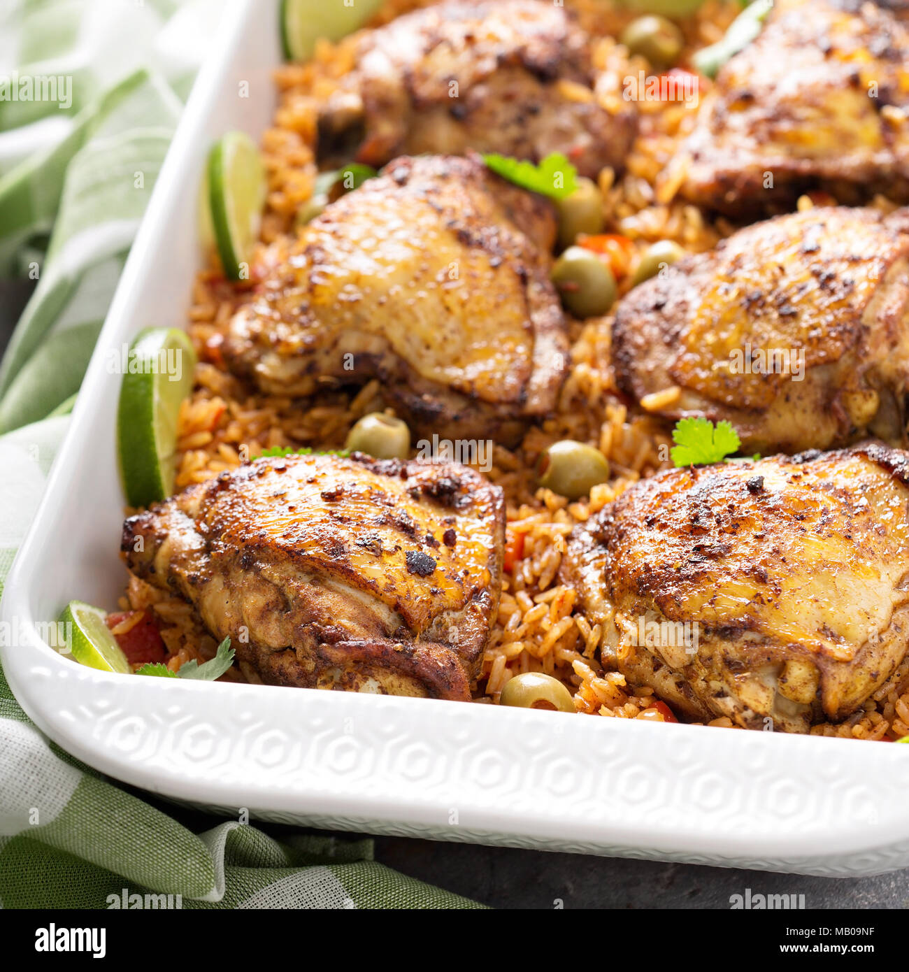 Arroz con Pollo, seared chicken with spanish rice and olives Stock Photo