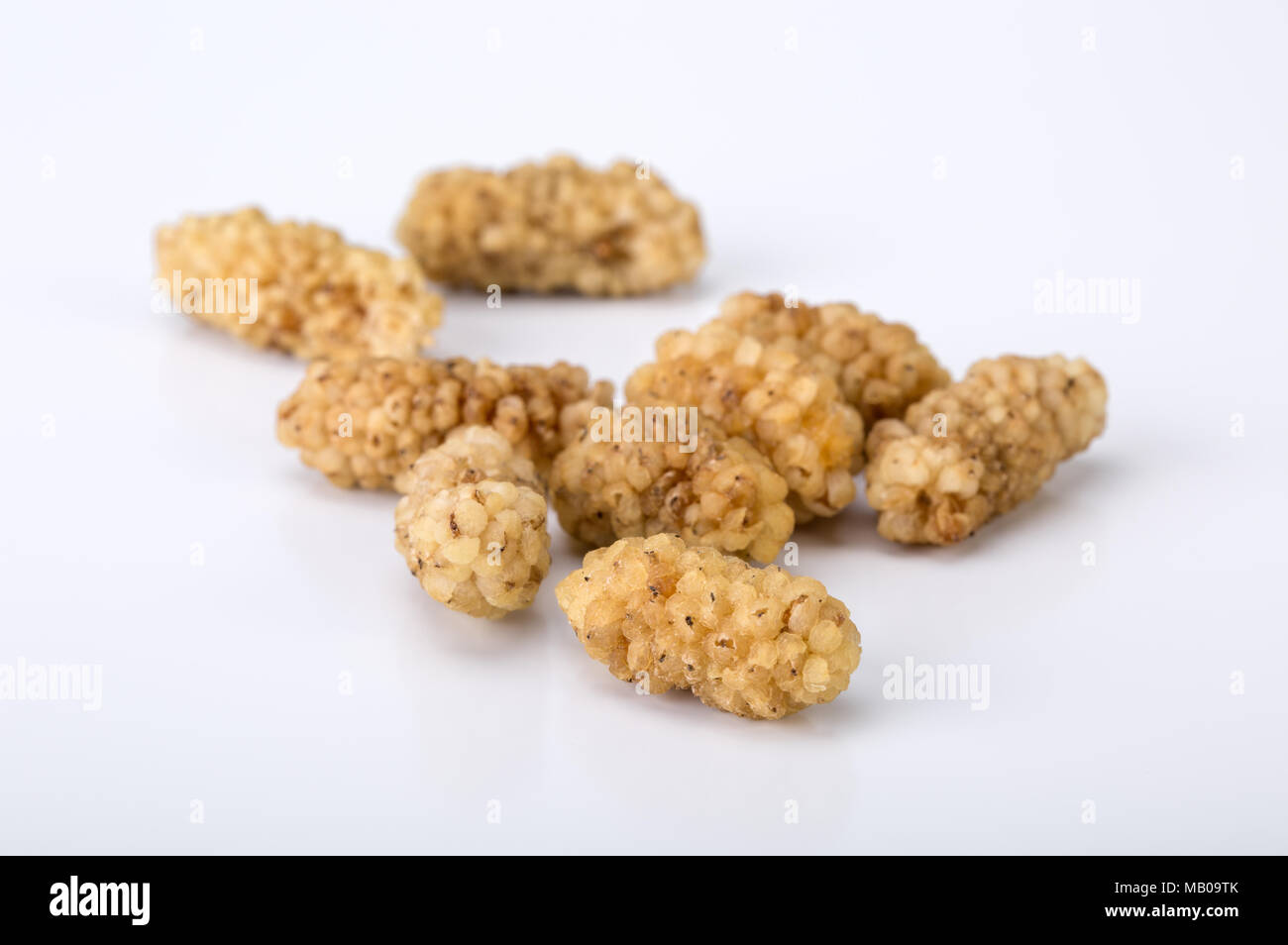 Close Up Shot Of Dried White Mulberries Fruits Isolated On White Background, A Healthy And Popular Sweet Snacks In Iran And Turkey Stock Photo