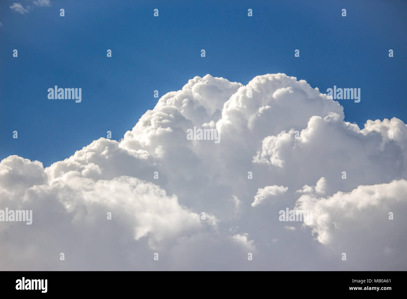 Blue sky with a lot of white puffy clouds Stock Photo - Alamy