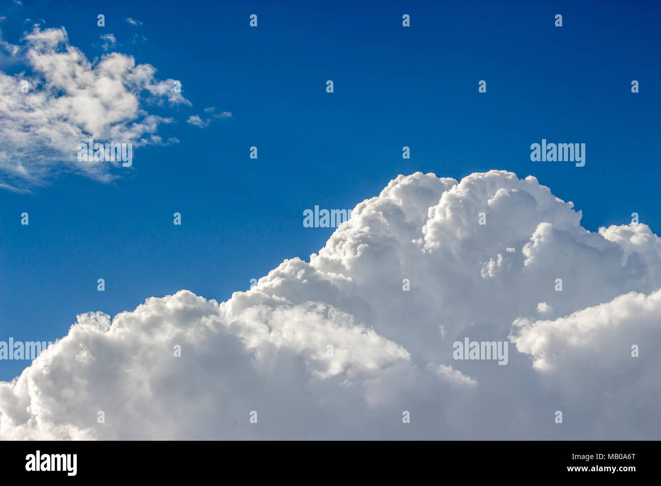 Blue sky with a lot of white puffy clouds Stock Photo - Alamy