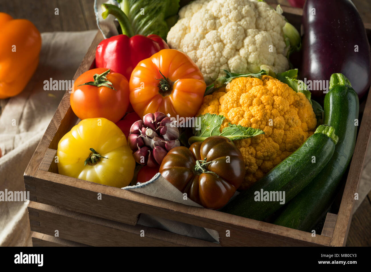 Healthy Organic Summer Farmers Market Box with Tomatoes Peppers and Cauliflower Stock Photo