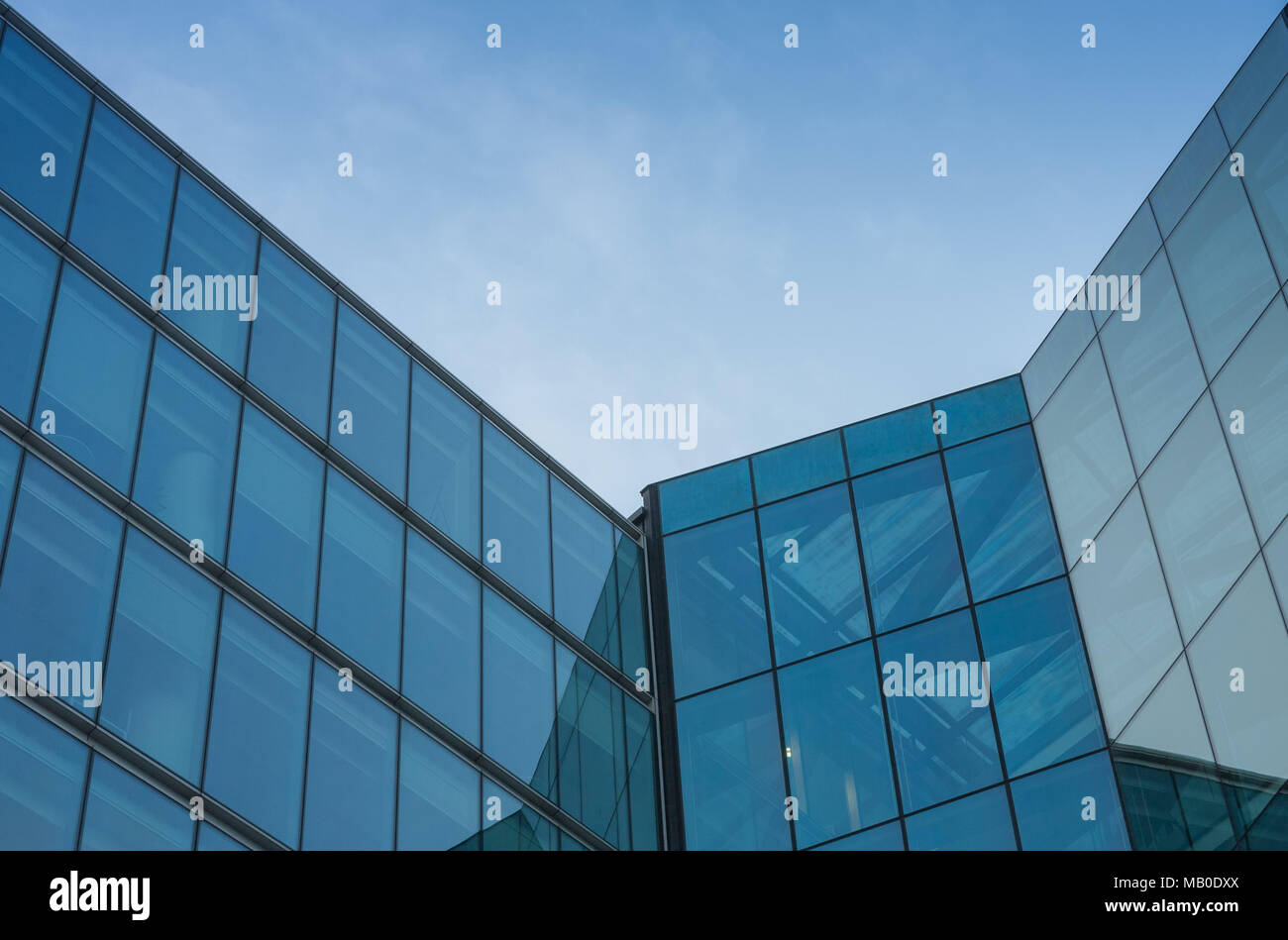 Glass facade, modern architecture with blue sky, morning shoot Stock ...