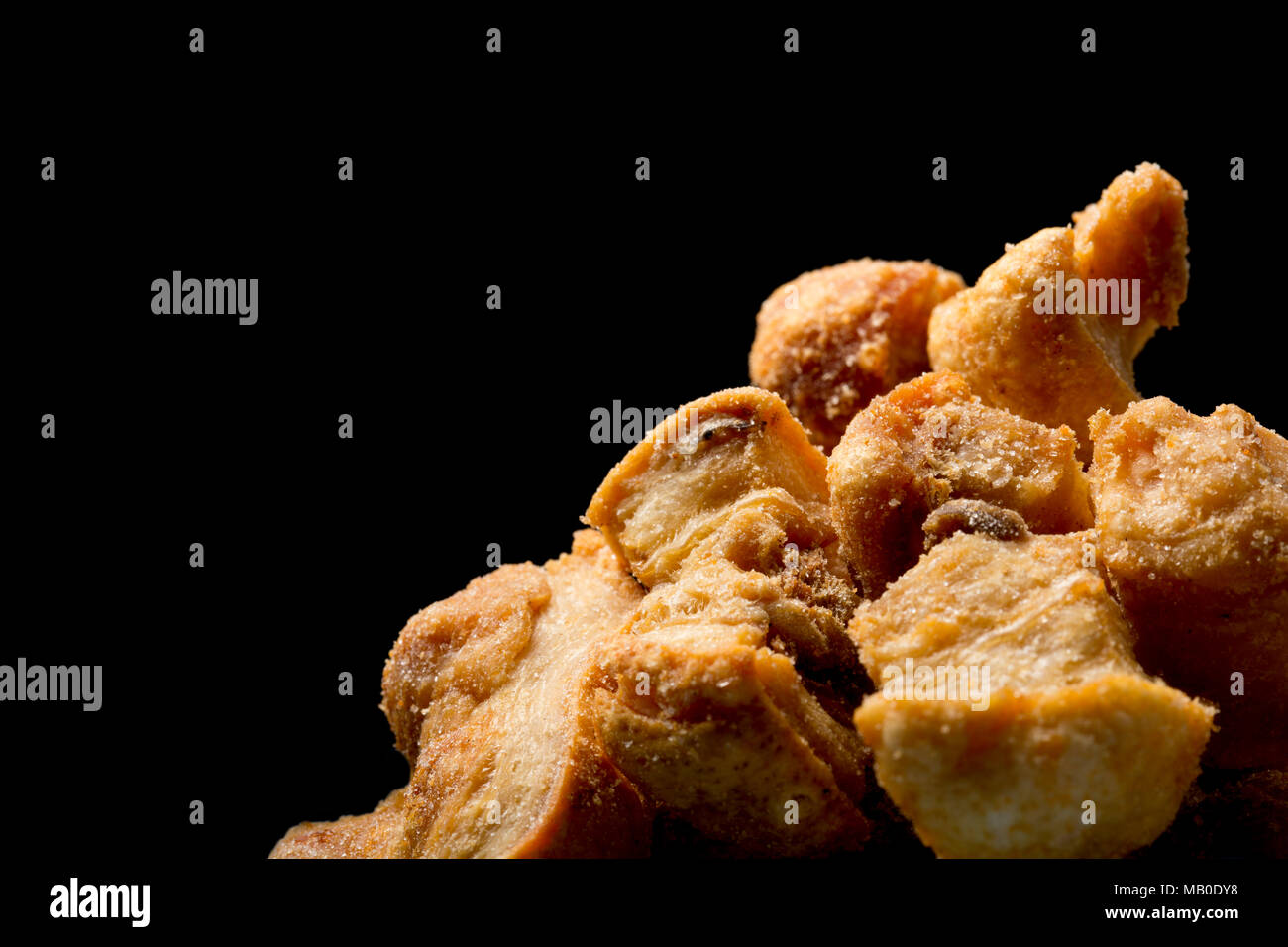 Pork scratchings from a packet bought in a supermarket. UK Stock Photo