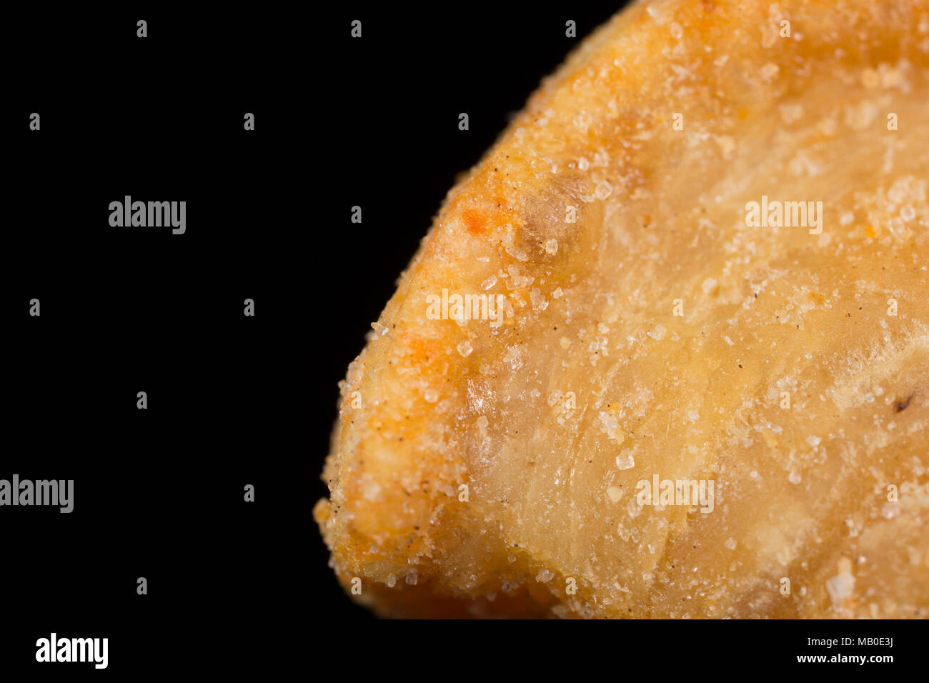 A pork scratching from a packet bought in a supermarket. UK Stock Photo