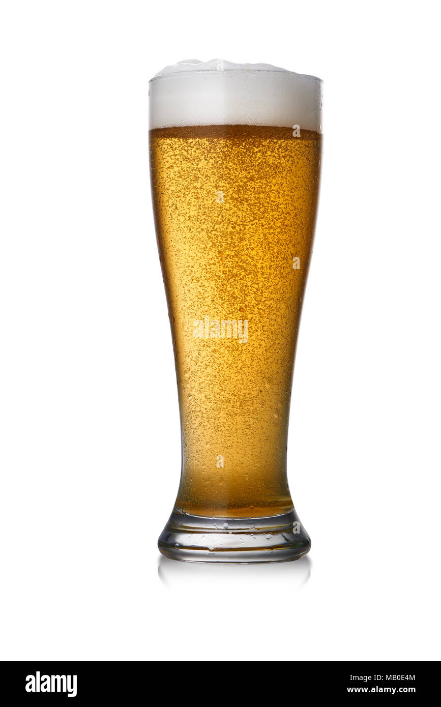 Freshly poured golden amber beer with frothy head and bubbles in a glass isolated on white Stock Photo