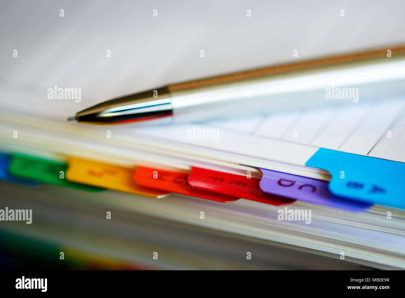 Selective focus alphabetical index address book with mechanical pencil. Stock Photo