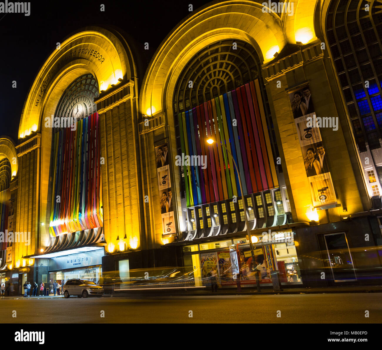 BUENOS AIRES, ARGENTINA - SEPTEMBER 20: heavy traffic on Corrientes Street by night. Abasto building facade at Buenos Aires, Argentina Stock Photo