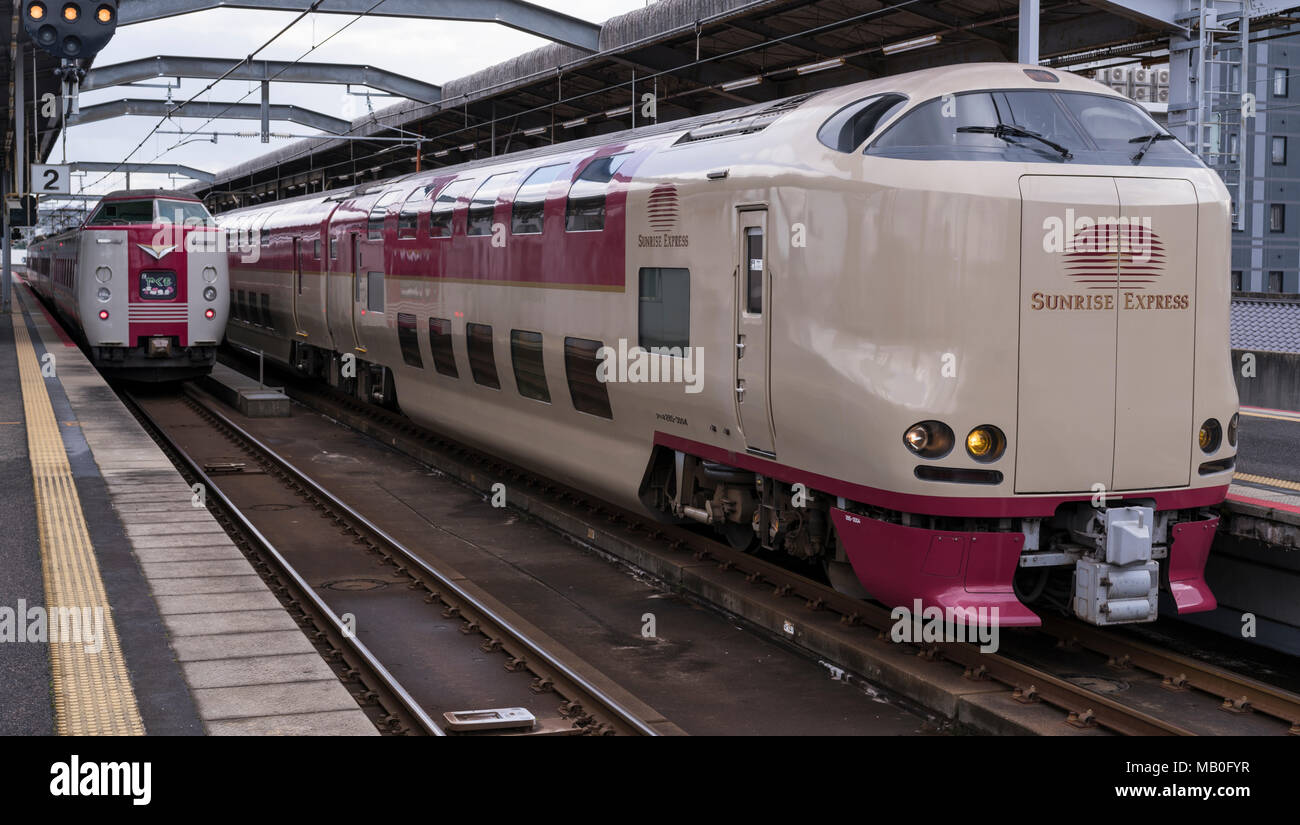 The Sunrise Express sleeper train and the Yakumo express train at Izumo Station in Shimane Prefecture, Japan. Stock Photo