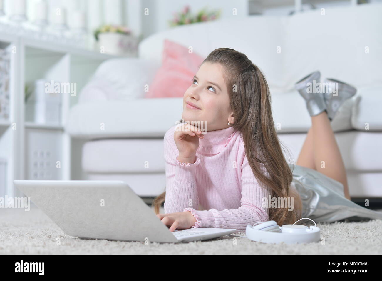 Beautiful teen girl using laptop Stock Photo - Alamy