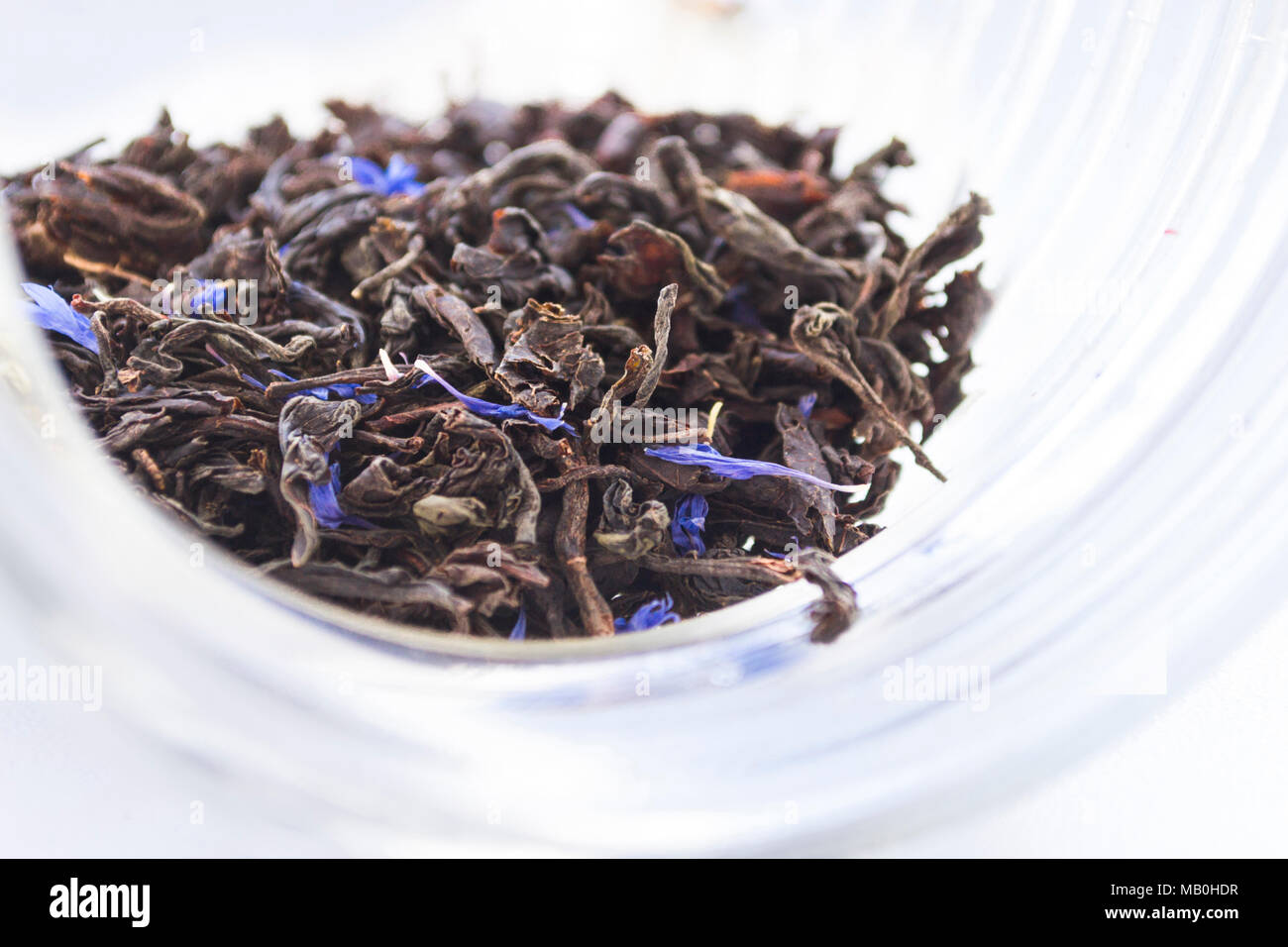 Dried Herbal Bergamot Tea Leaves In Transparent Glass Jar On Light Background Stock Photo Alamy