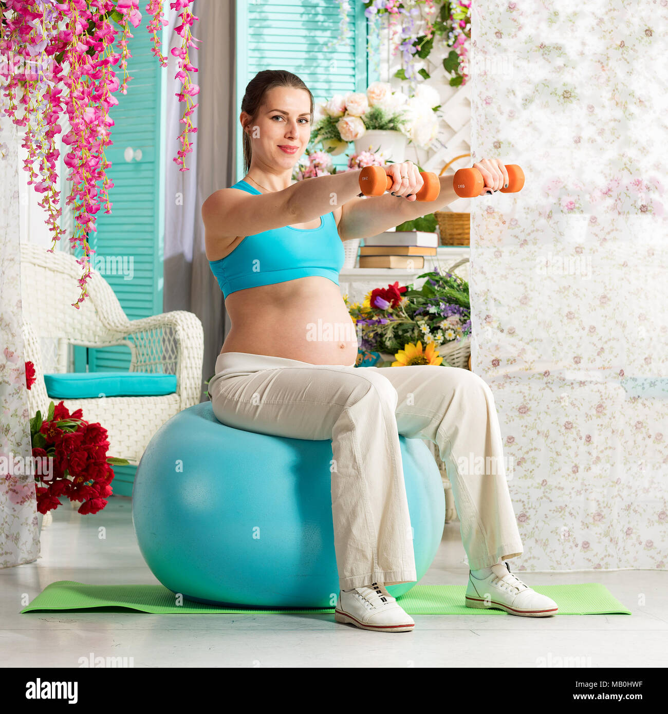 Pregnant woman during workout Stock Photo