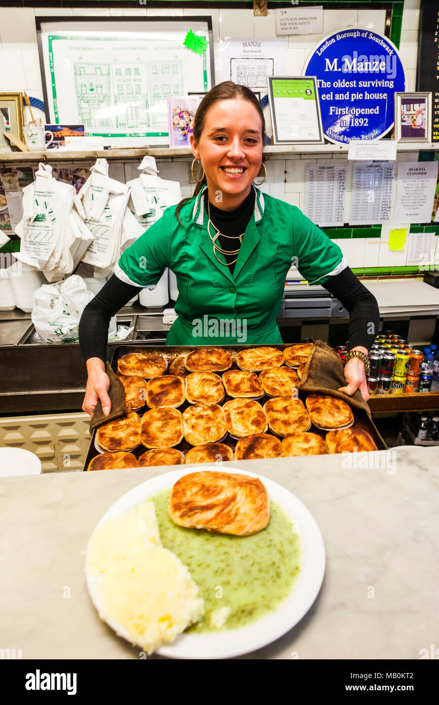 England, London, Southwark, Manze Pie and Mash Shop, Assistant Holding