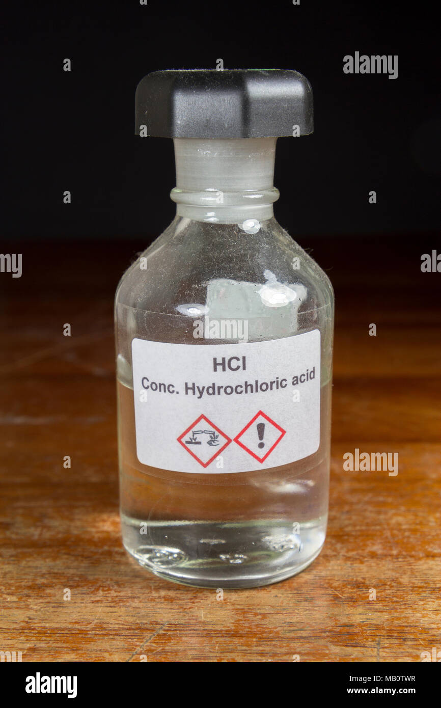 A bottle of concentrated hydrochloric acid (HCl) as used in a UK secondary school, London, UK. Stock Photo