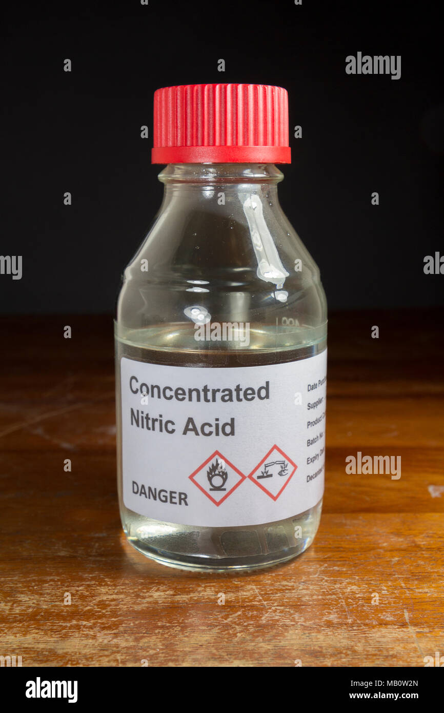 A bottle of concentrated nitric acid HNO3 as used in a UK