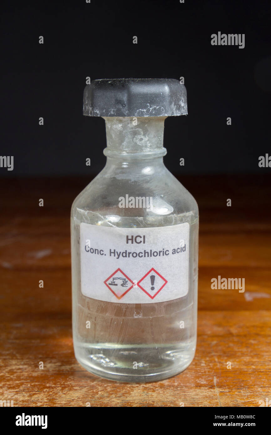 A bottle of concentrated hydrochloric acid as used in a UK secondary school, London, UK. Stock Photo