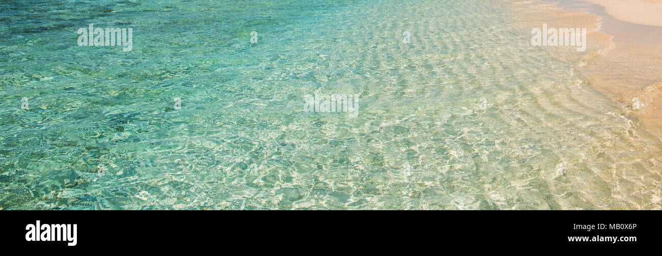clear ocean water at beach - turquoise water vacation background Stock