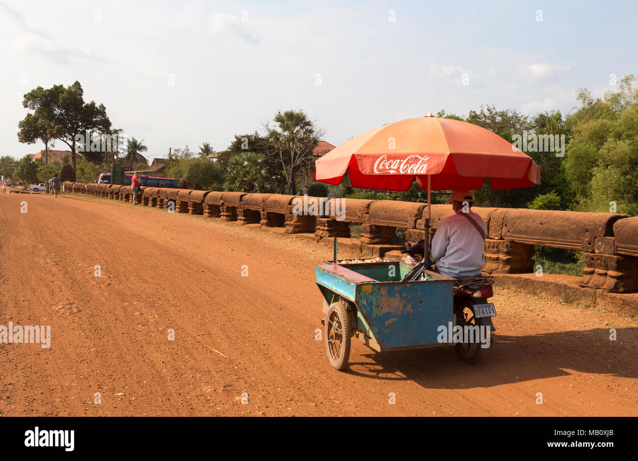 Drinks motorbike advertising Coca Cola, the Naga bridge, Cambodia, Asia Stock Photo