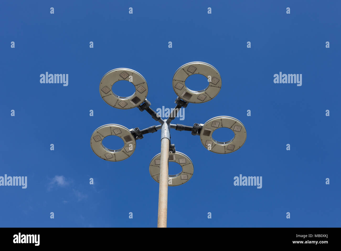 Modern street light against blue sky Stock Photo