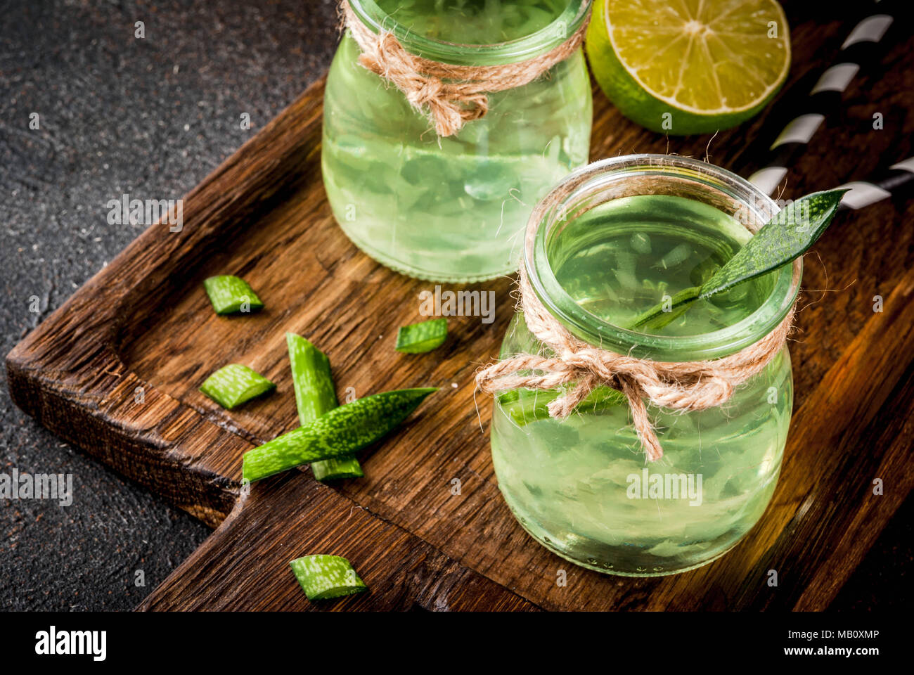 Healthy exotic detox drink, aloe vera or cactus juice with lime, on dark  background copy space Stock Photo - Alamy