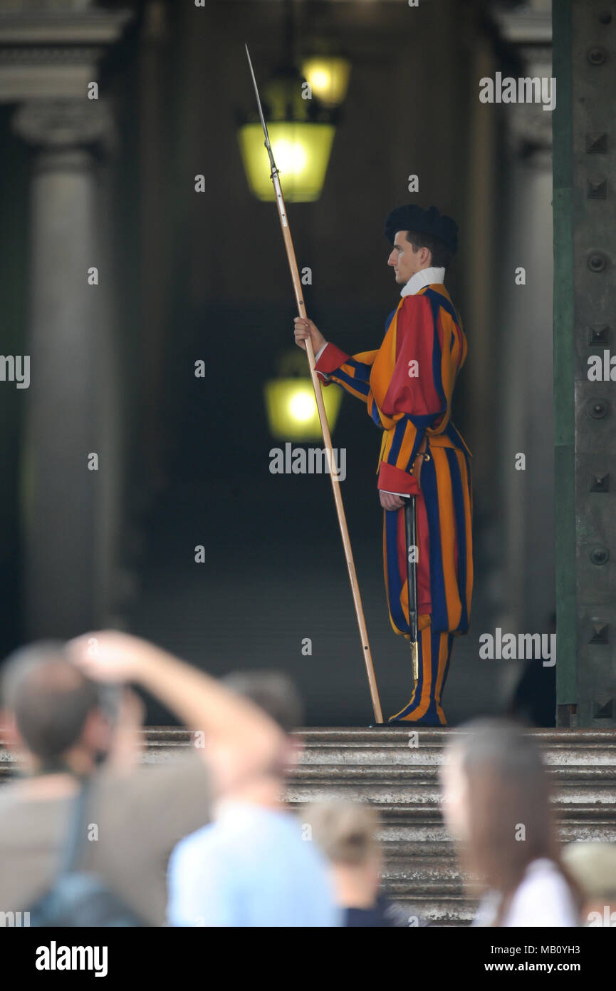 A member of the Pontifical Swiss Guard with halberd in Portone di