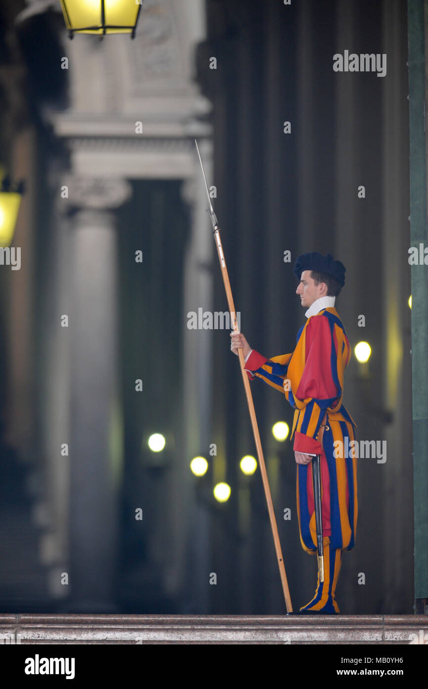 A member of the Pontifical Swiss Guard with halberd in Portone di