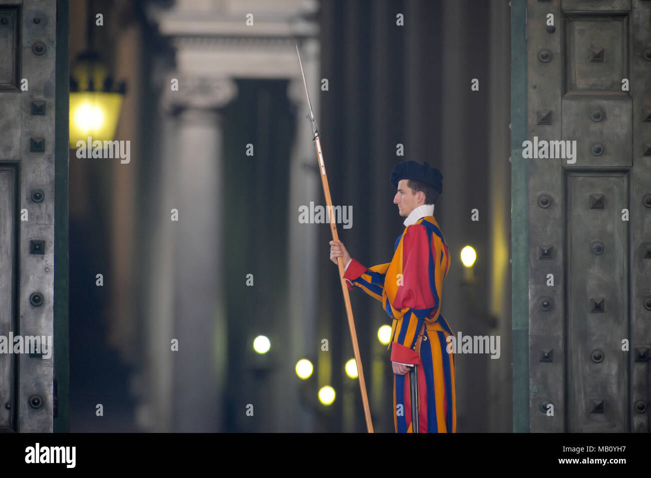 A member of the Pontifical Swiss Guard with halberd in Portone di