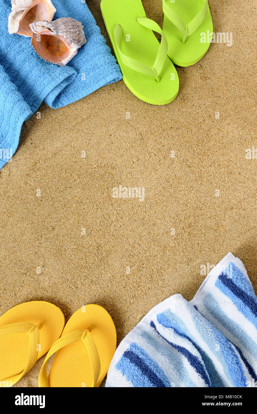 Beach background with towel and flip flops Stock Photo - Alamy