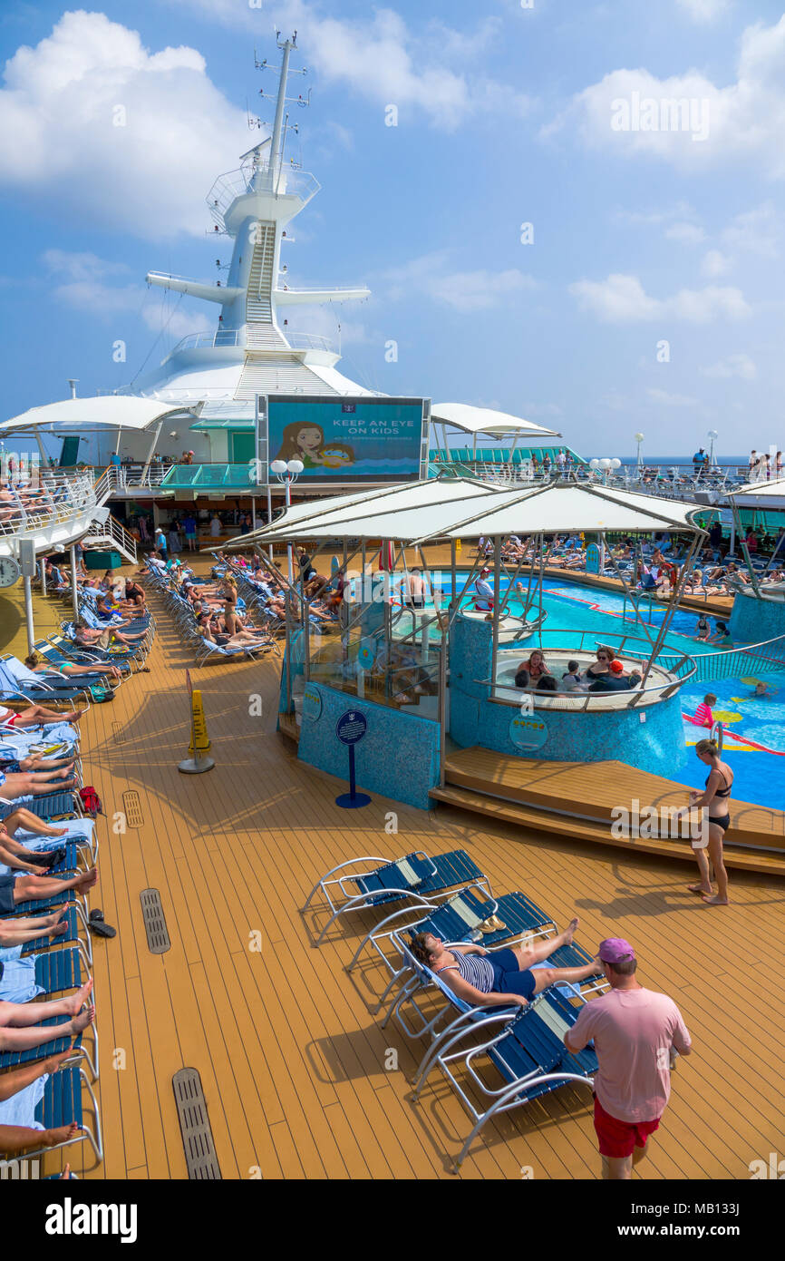 Poolside Activities aboard the cruise ship Royal Caribbean Rhapsody of the Seas at sea in the Gulf of Mexico Stock Photo
