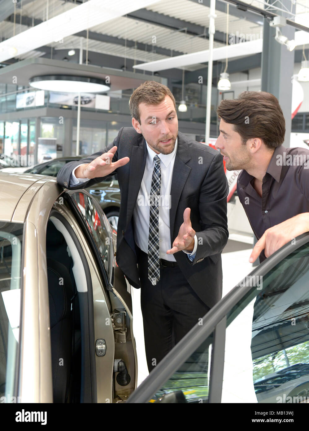 Car salesmen work in showroom hires stock photography and images Alamy