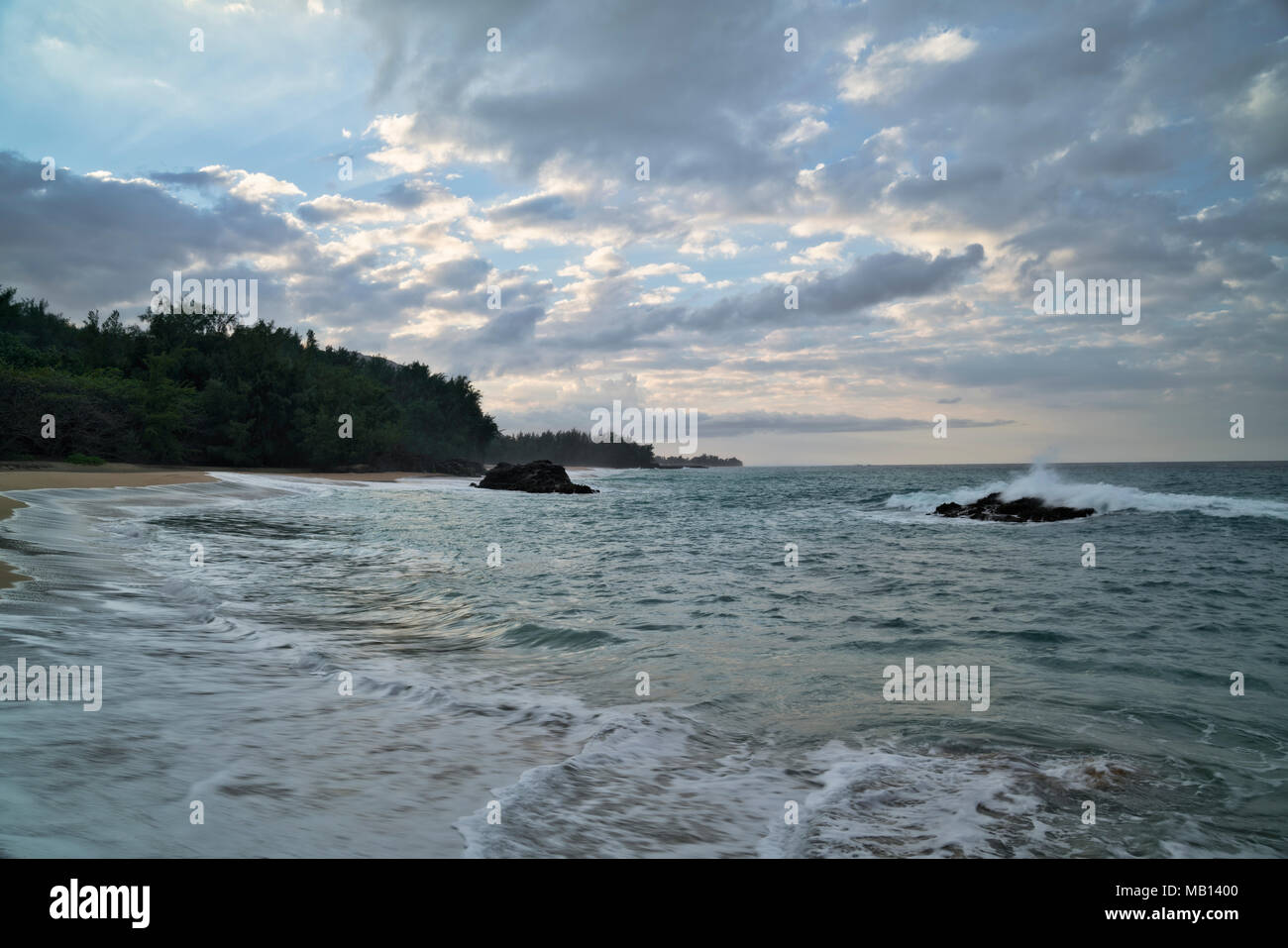 Evening clearing with incoming tide at Lumaha’i Beach along the North Shore on Hawaii’s Island of Kauai. Stock Photo