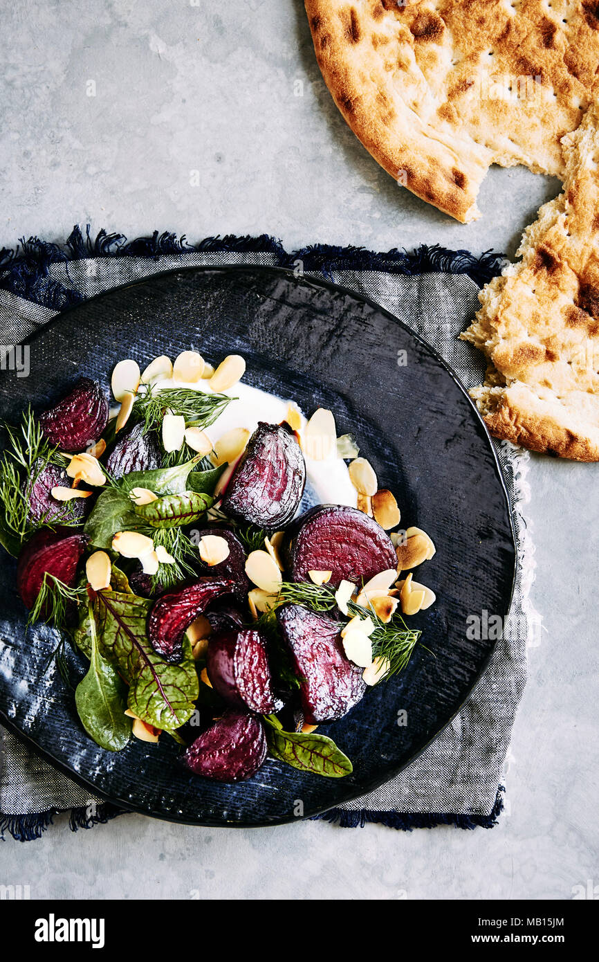 roasted beetroot salad with yogurt dressing, dill, spinage and toasted