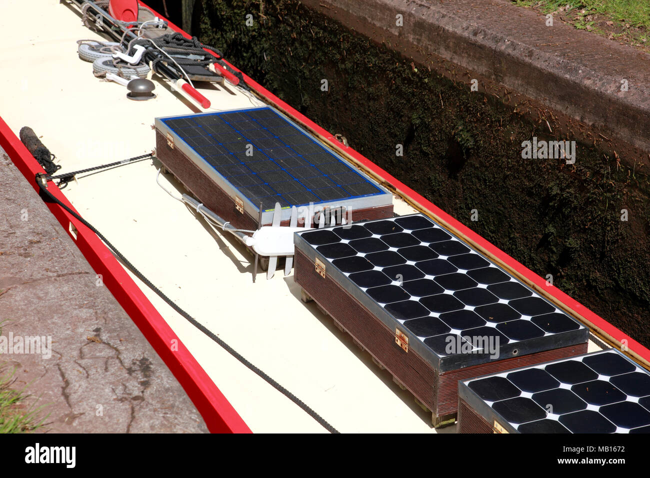 Solar panels on the roof of a canal narrowboat in a lock Stock Photo