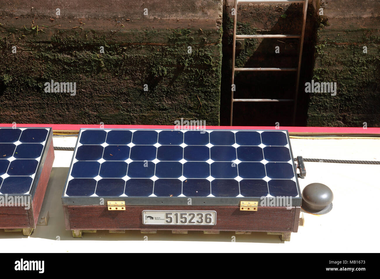 Solar panels on the roof of a canal narrowboat in a lock Stock Photo