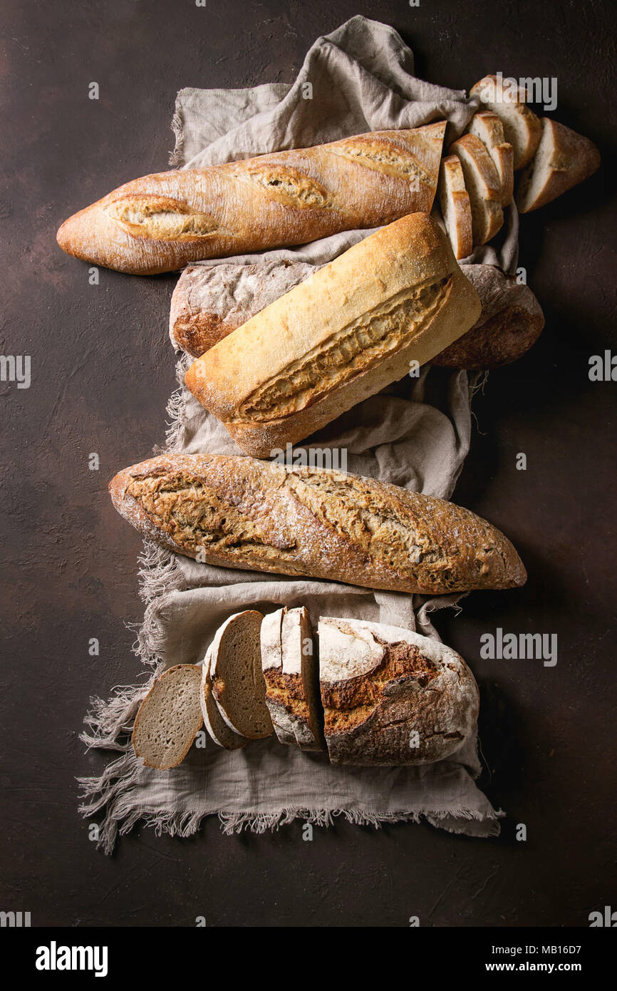 Variety of loafs fresh baked artisan rye, white and whole grain bread ...
