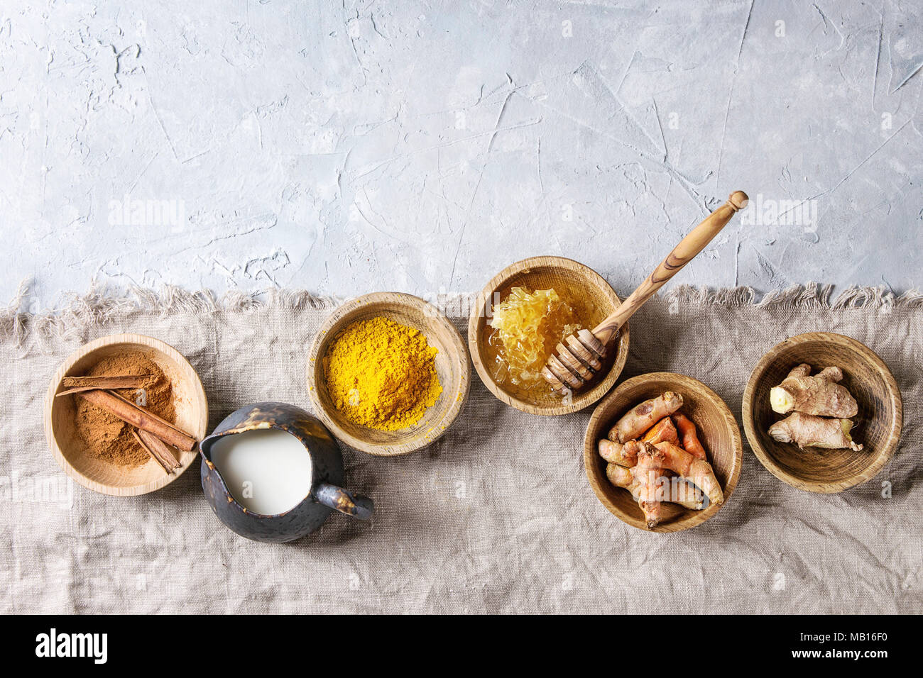 Ingredients for turmeric latte. Ground turmeric, curcuma root, cinnamon